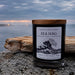 Sea Hag candle by Rockport Candle Company with ocean and fog in the background
